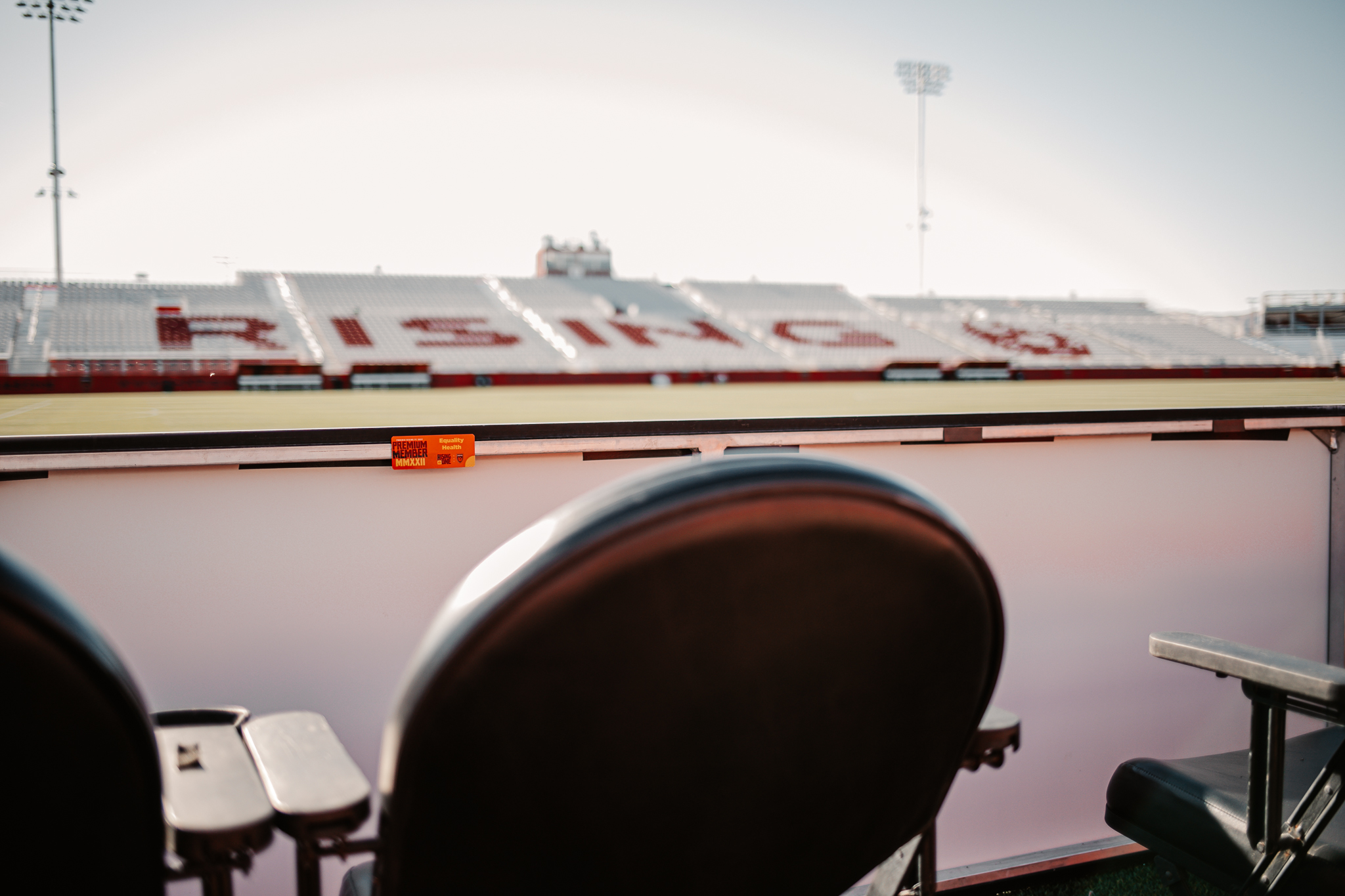 Shot of the "Rising" bleachers from behind a black field-level seat.